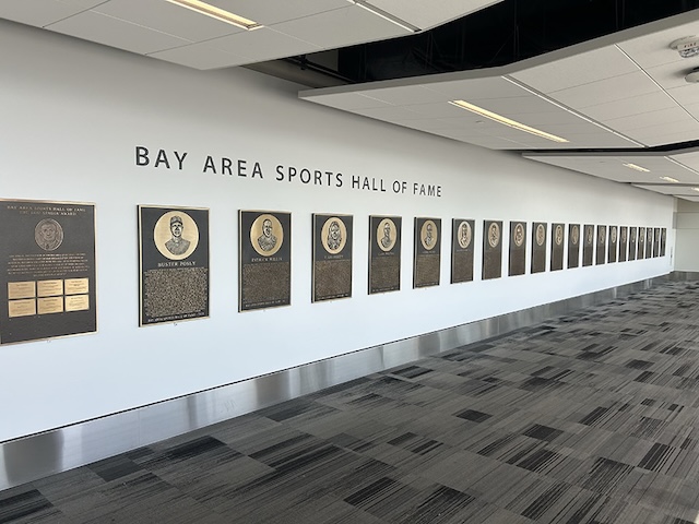 Bay Area Sports Hall of Fame plaque display extending down the airport hallway